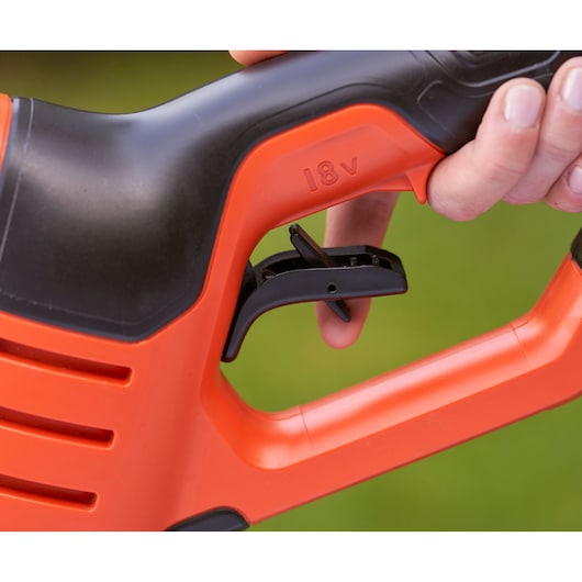 BLACKDECKER BCPC18D1 power tool handle with black trigger and 18V marking, close-up photo.