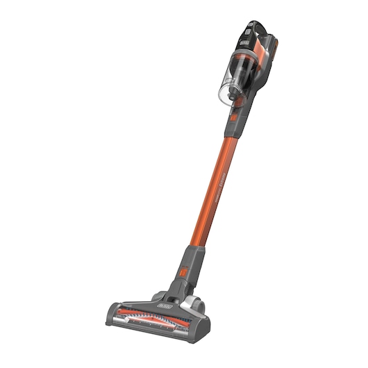 A BLACK+DECKER cordless stick vacuum cleaner with an orange and black design, featuring a transparent dust container, angled handle, and a wide floor brush.