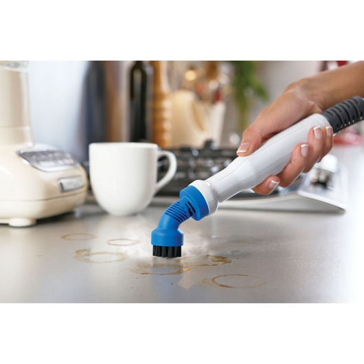 Photo of BLACKDECKER FSMH1351SM steam cleaner handheld brush head cleaning kitchen counter stains.