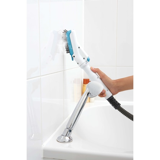 BLACKDECKER FSMHSS steam cleaning brush used on bathroom tiles, close-up view.