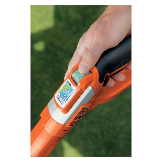 BLACK+DECKER GLC3630L20 grass trimmer handle close-up showing control dial and logo.