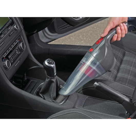 BLACKDECKER NV1210AV handheld vacuum cleaner used to clean car interior, photo from above.