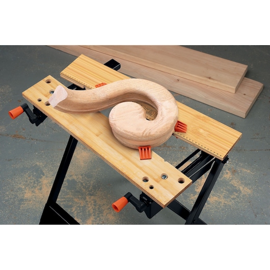 BLACKDECKER WM301 workbench photography, wood project clamped, top angle, orange handles, SKU WM301.