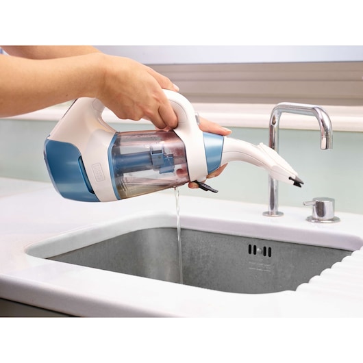 BLACKDECKER WW100 wet vacuum cleaner with blue and white body draining water into sink, side angle.